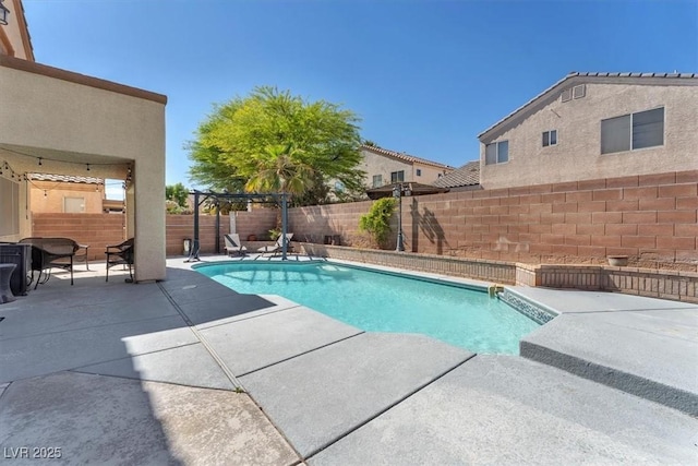 2104 Spanish Town Ave, North Las Vegas, NV 89031 - view of swimming pool featuring a patio area and a fenced backyard