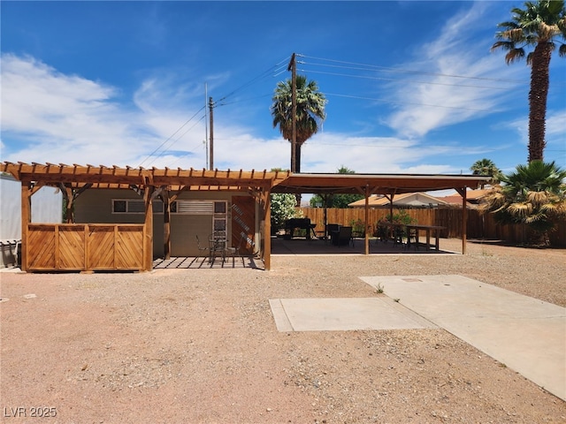 view of property's community with fence, a patio, and a pergola