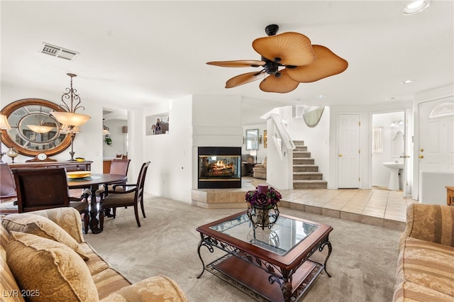 9522 Arrowhead Falls Ct, Las Vegas, NV 89148 - carpeted living area with recessed lighting, stairway, a fireplace, and a ceiling fan
