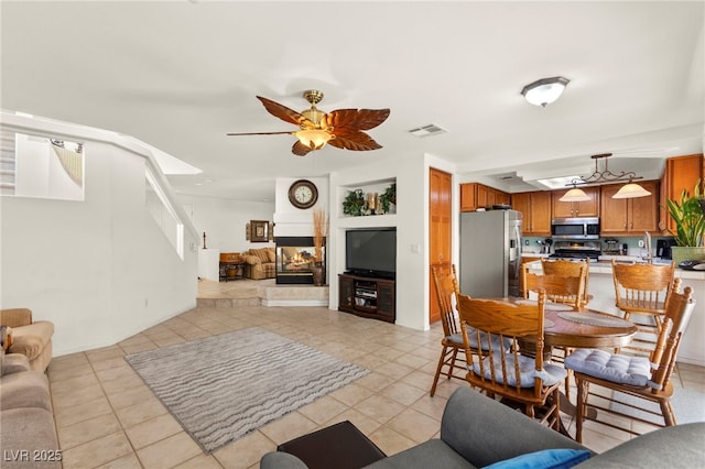 9522 Arrowhead Falls Ct, Las Vegas, NV 89148 - living area featuring light tile patterned flooring and ceiling fan