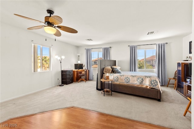 9522 Arrowhead Falls Ct, Las Vegas, NV 89148 - carpeted bedroom with a ceiling fan, baseboards, and wood finished floors