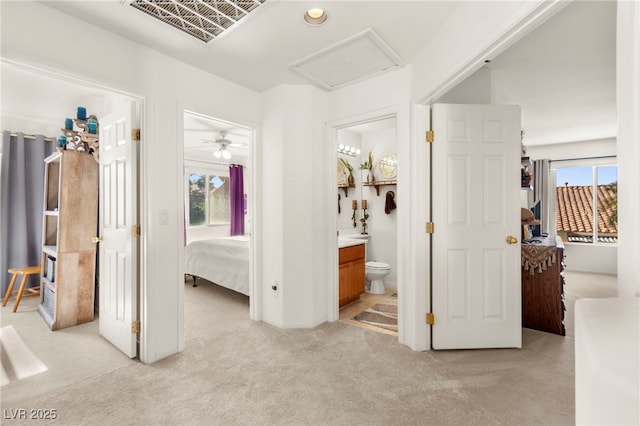 9522 Arrowhead Falls Ct, Las Vegas, NV 89148 - unfurnished bedroom featuring light carpet, multiple windows, attic access, and ensuite bathroom