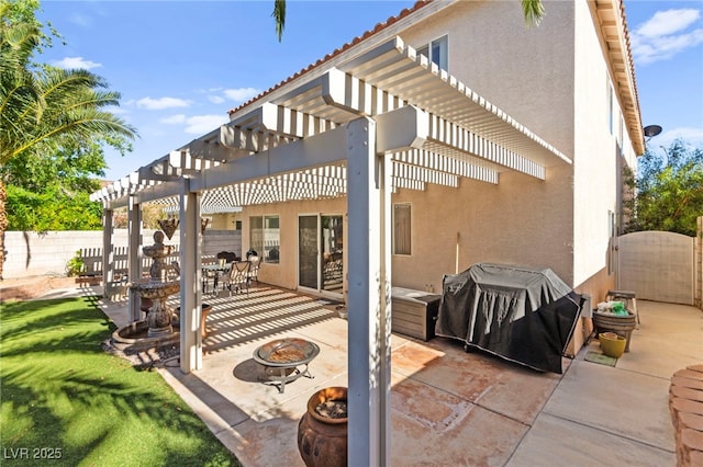 9522 Arrowhead Falls Ct, Las Vegas, NV 89148 - view of patio / terrace featuring a fire pit, a pergola, grilling area, and fence