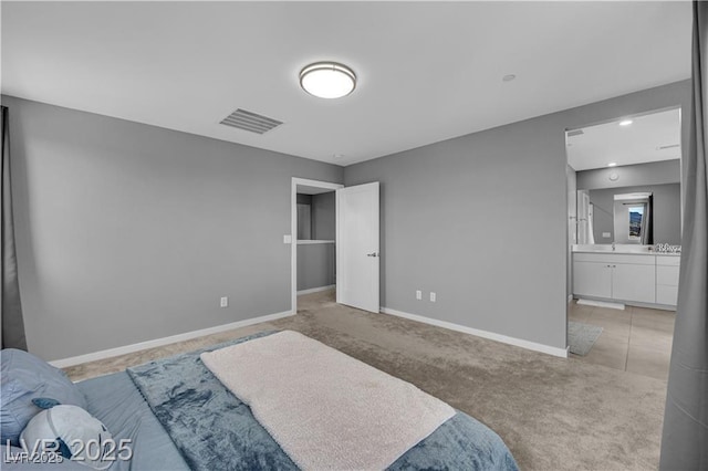 3192 Timorasso Ave, Henderson, NV 89044 - bedroom featuring light carpet, baseboards, and ensuite bathroom