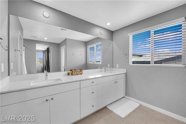 3192 Timorasso Ave, Henderson, NV 89044 - bathroom with tile patterned floors, double vanity, baseboards, and recessed lighting