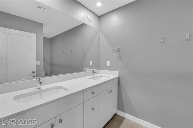 3192 Timorasso Ave, Henderson, NV 89044 - full bath featuring toilet, baseboards, and double vanity