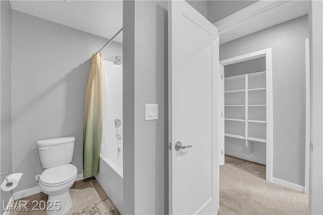 3192 Timorasso Ave, Henderson, NV 89044 - bathroom featuring toilet, shower / tub combo with curtain, baseboards, and a spacious closet