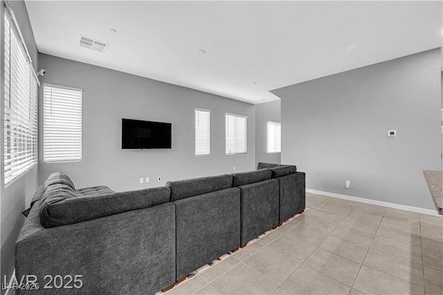 3192 Timorasso Ave, Henderson, NV 89044 - unfurnished living room with baseboards and light tile patterned floors