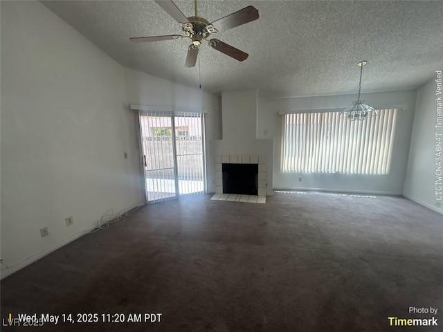 6512 Sterling Springs Pkwy, Las Vegas, NV 89108 - unfurnished living room featuring a textured ceiling, a chandelier, a tiled fireplace, a ceiling fan, and carpet