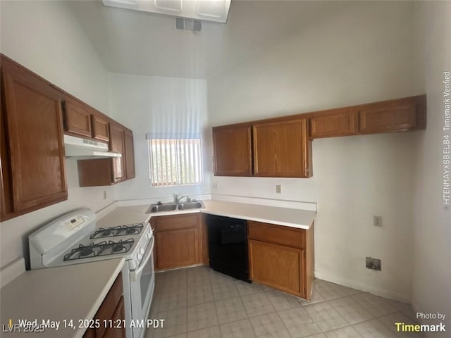 6512 Sterling Springs Pkwy, Las Vegas, NV 89108 - kitchen featuring white gas range oven, black dishwasher, a sink, under cabinet range hood, and brown cabinets