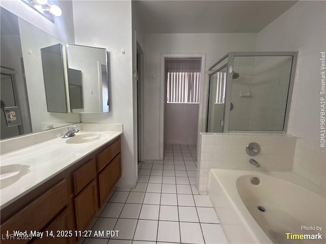 6512 Sterling Springs Pkwy, Las Vegas, NV 89108 - bathroom with tile patterned flooring, a stall shower, a garden tub, and double vanity