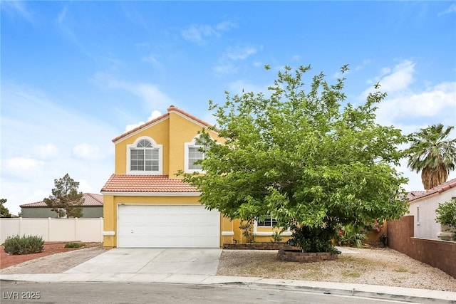 1117 Coral Crystal Ct, North Las Vegas, NV 89032 - view of front facade featuring concrete driveway, a tiled roof, an attached garage, fence, and stucco siding