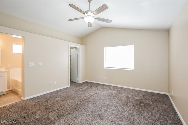 1117 Coral Crystal Ct, North Las Vegas, NV 89032 - unfurnished bedroom with light colored carpet, lofted ceiling, baseboards, and ensuite bath