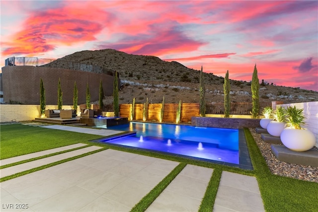 2601 Nevada Agave Ln, Las Vegas, NV 89138 - view of pool with a patio, a mountain view, and an outdoor living space