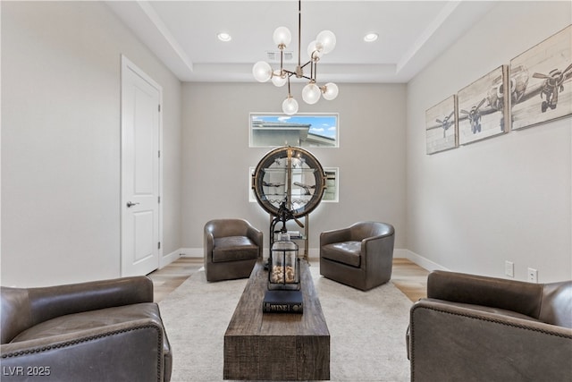 2601 Nevada Agave Ln, Las Vegas, NV 89138 - sitting room featuring a chandelier, a tray ceiling, wood finished floors, recessed lighting, and baseboards