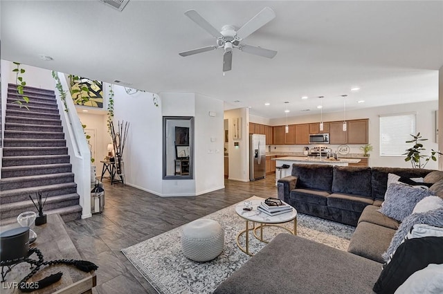8164 Golden Cholla Ave, Las Vegas, NV 89179 - living room with stairs, ceiling fan, recessed lighting, baseboards, and dark wood finished floors
