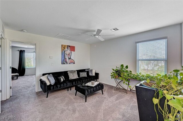 8164 Golden Cholla Ave, Las Vegas, NV 89179 - living room featuring healthy amount of natural light, carpet floors, and a ceiling fan