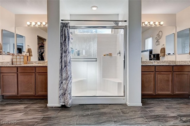 8164 Golden Cholla Ave, Las Vegas, NV 89179 - bathroom featuring a stall shower and two vanities