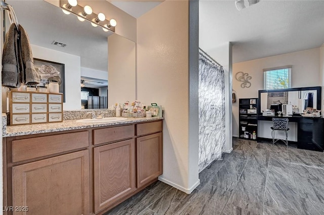 8164 Golden Cholla Ave, Las Vegas, NV 89179 - bathroom featuring vanity, a shower with curtain, baseboards, and marble finish floors