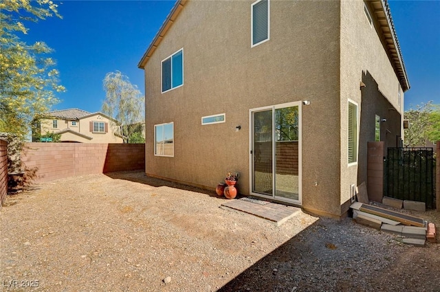 8164 Golden Cholla Ave, Las Vegas, NV 89179 - rear view of property with stucco siding and a fenced backyard