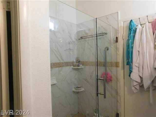 6201 E Lake Mead Blvd Unit 218, Las Vegas, NV 89156 - bathroom featuring a marble finish shower