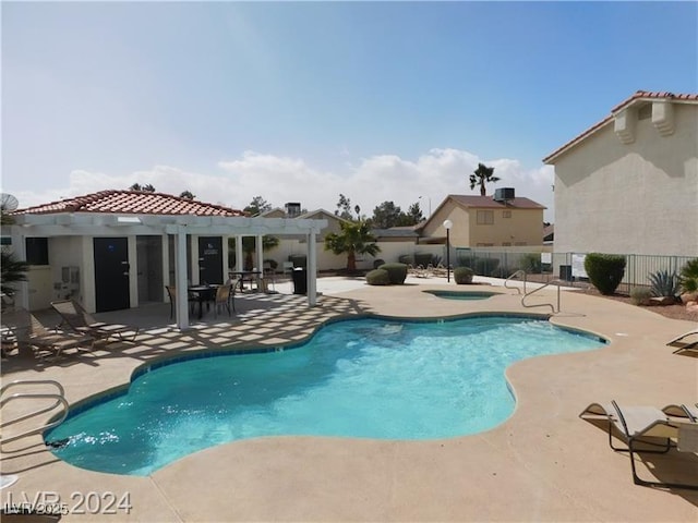 6201 E Lake Mead Blvd Unit 218, Las Vegas, NV 89156 - community pool featuring fence, a patio, a hot tub, and a pergola