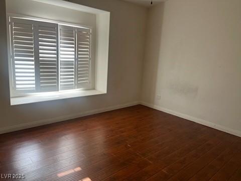 6201 E Lake Mead Blvd Unit 218, Las Vegas, NV 89156 - spare room featuring baseboards and wood finished floors