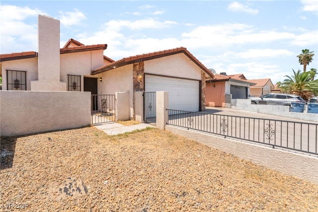 1729 Yellow Rose St, Las Vegas, NV 89108 - view of front of home featuring a garage, stucco siding, a gate, a tile roof, and driveway