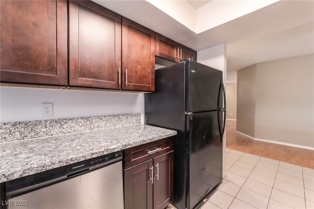 1729 Yellow Rose St, Las Vegas, NV 89108 - kitchen with dishwasher, freestanding refrigerator, light tile patterned floors, and dark brown cabinetry