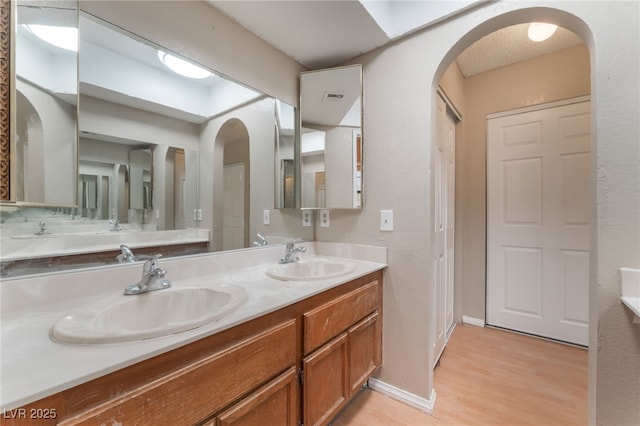 1729 Yellow Rose St, Las Vegas, NV 89108 - full bath with wood finished floors, double vanity, and baseboards