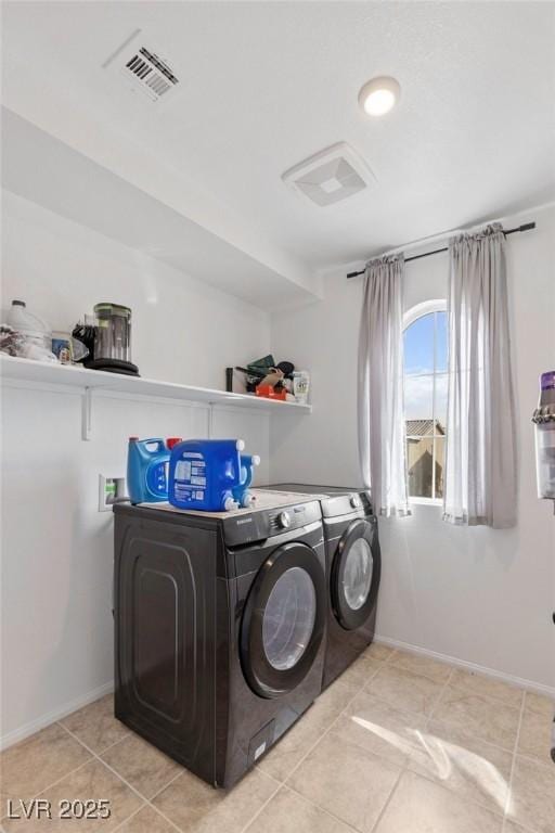 10376 Sadie Blake Ave, Las Vegas, NV 89166 - laundry area featuring washing machine and dryer, baseboards, and tile patterned flooring