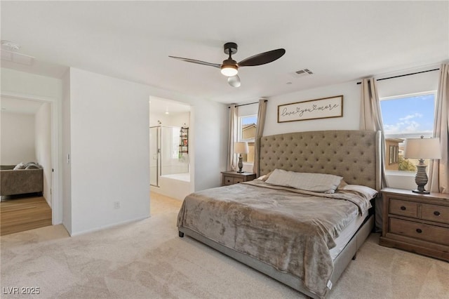 10376 Sadie Blake Ave, Las Vegas, NV 89166 - carpeted bedroom with multiple windows, a ceiling fan, and ensuite bath
