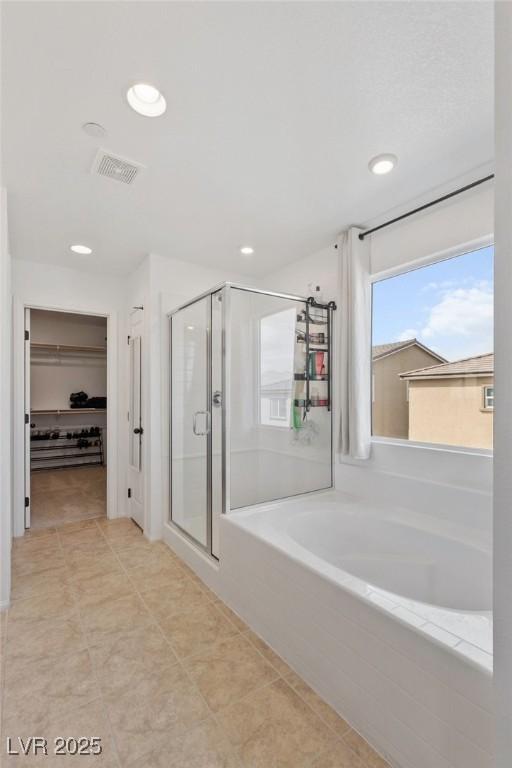 10376 Sadie Blake Ave, Las Vegas, NV 89166 - bathroom with a shower stall, a walk in closet, a bath, recessed lighting, and tile patterned flooring