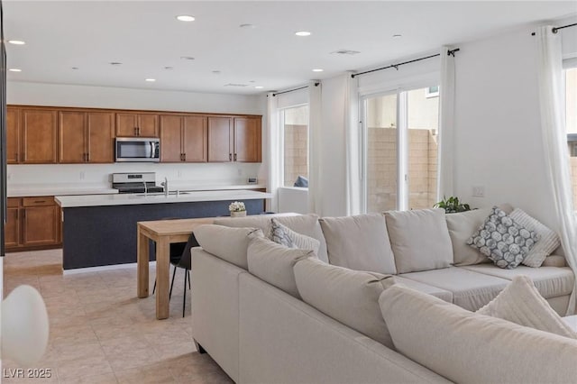 10376 Sadie Blake Ave, Las Vegas, NV 89166 - living room featuring recessed lighting and light tile patterned floors