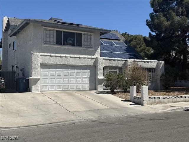 3061 Brockington Dr, Las Vegas, NV 89120 - view of front facade with solar panels, stucco siding, and driveway