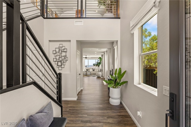390 Coastal Redwood St, Las Vegas, NV 89138 - foyer with stairs, baseboards, dark wood-style flooring, and a towering ceiling