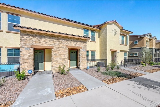 1125 Meadow Sparrow Pl, Henderson, NV 89011 - multi unit property featuring stone siding, fence, and stucco siding
