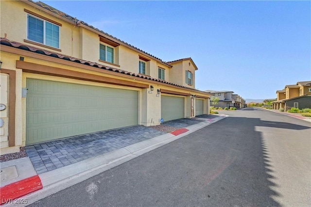 1125 Meadow Sparrow Pl, Henderson, NV 89011 - view of asphalt road featuring a residential view
