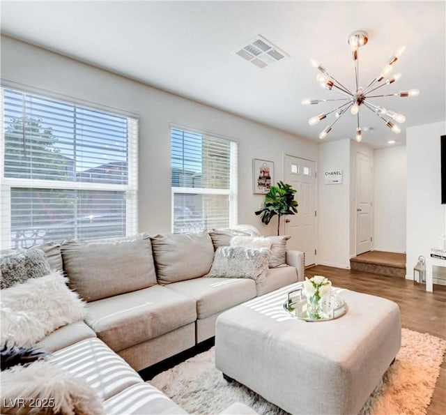 1125 Meadow Sparrow Pl, Henderson, NV 89011 - living room featuring a chandelier, wood finished floors, and baseboards
