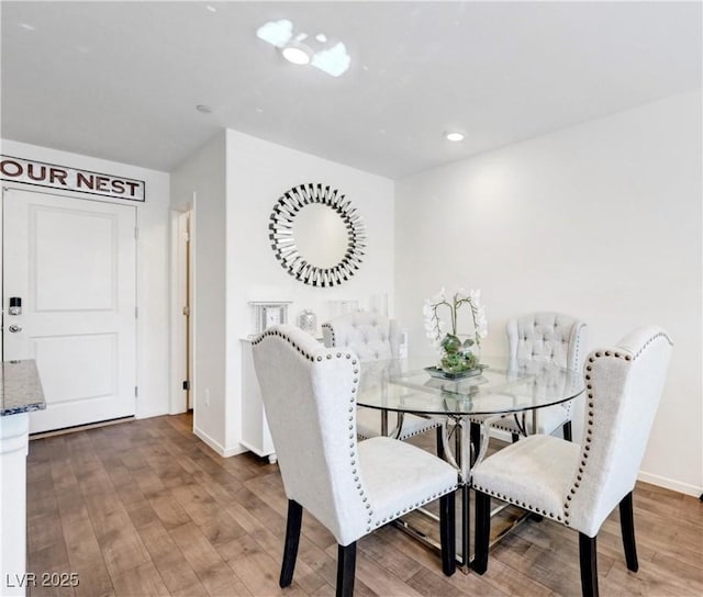 1125 Meadow Sparrow Pl, Henderson, NV 89011 - dining space featuring wood finished floors, baseboards, and recessed lighting