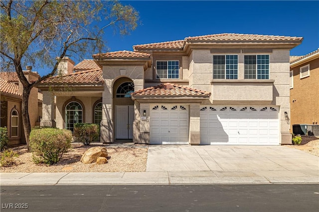 4607 El Camino Cabos Dr, Las Vegas, NV 89147 - view of front facade with a tiled roof, stucco siding, an attached garage, and concrete driveway