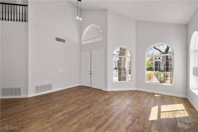 4607 El Camino Cabos Dr, Las Vegas, NV 89147 - foyer entrance with wood finished floors, a high ceiling, and baseboards