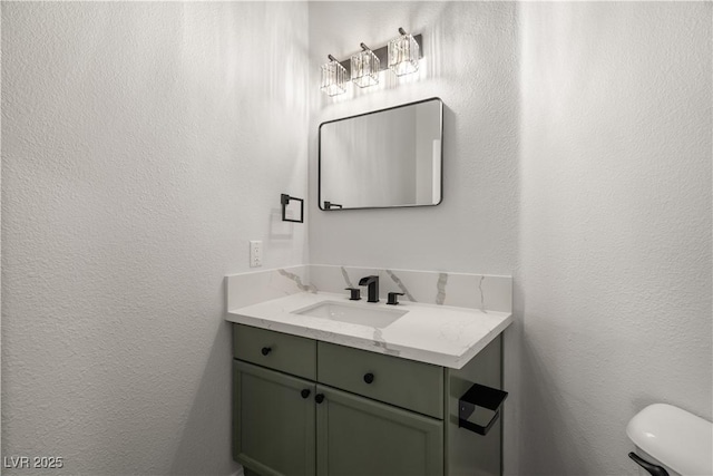 4607 El Camino Cabos Dr, Las Vegas, NV 89147 - half bath with a textured wall, vanity, and toilet