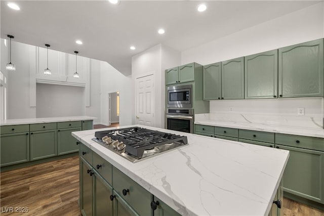 4607 El Camino Cabos Dr, Las Vegas, NV 89147 - kitchen featuring green cabinetry, stainless steel appliances, dark wood finished floors, light stone countertops, and recessed lighting