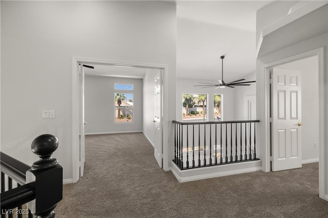 4607 El Camino Cabos Dr, Las Vegas, NV 89147 - hallway with carpet, an upstairs landing, and baseboards