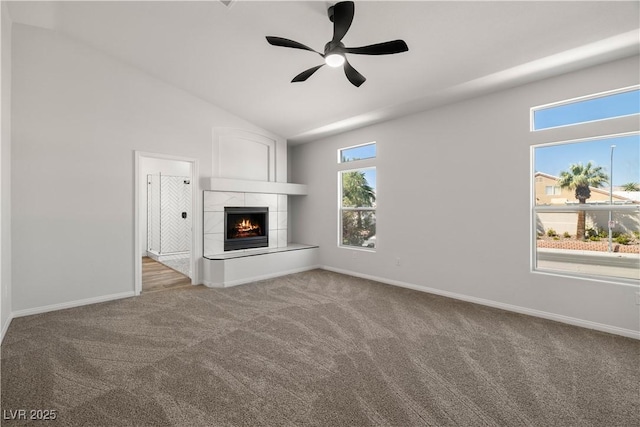 4607 El Camino Cabos Dr, Las Vegas, NV 89147 - unfurnished living room with carpet flooring, a ceiling fan, baseboards, and vaulted ceiling