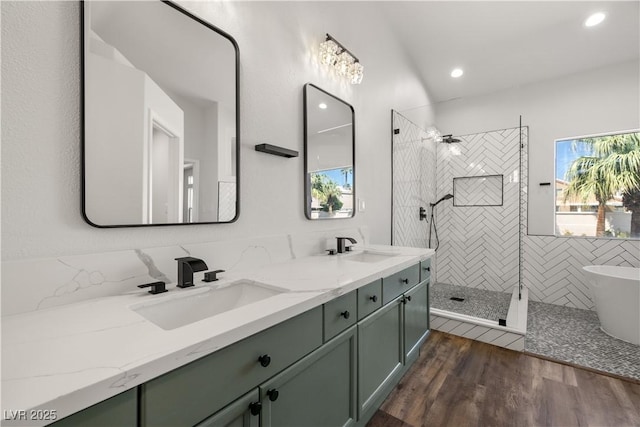 4607 El Camino Cabos Dr, Las Vegas, NV 89147 - full bathroom featuring walk in shower, double vanity, wood finished floors, a freestanding bath, and recessed lighting