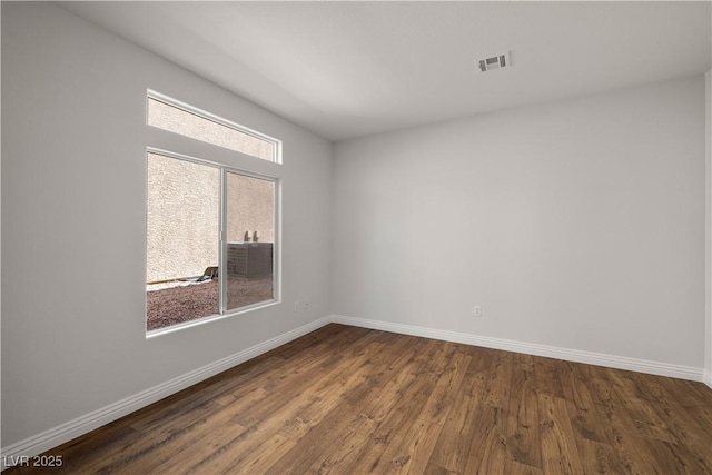 4607 El Camino Cabos Dr, Las Vegas, NV 89147 - empty room with dark wood-type flooring and baseboards