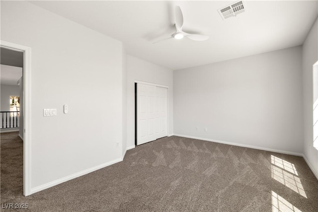 4607 El Camino Cabos Dr, Las Vegas, NV 89147 - unfurnished bedroom featuring dark colored carpet, baseboards, a closet, and a ceiling fan