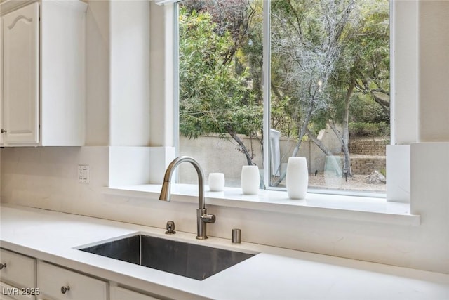801 Aquitaine Ct, Las Vegas, NV 89145 - kitchen view of light countertops and white cabinets